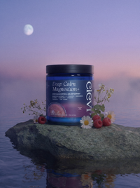 Clevr Deep Calm Magnesium jar on a rock with flowers and berries, moonlit sky