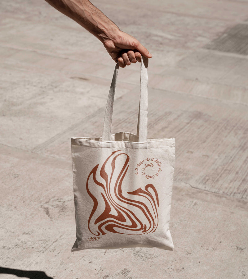 Person holding Clevr tote bag